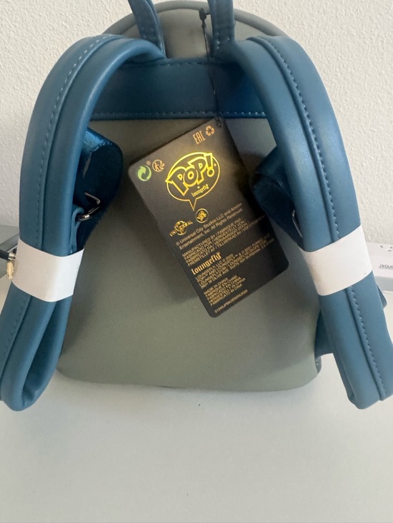 Loungefly Grey Monster Face Mini Backpack with Pink Tongue
